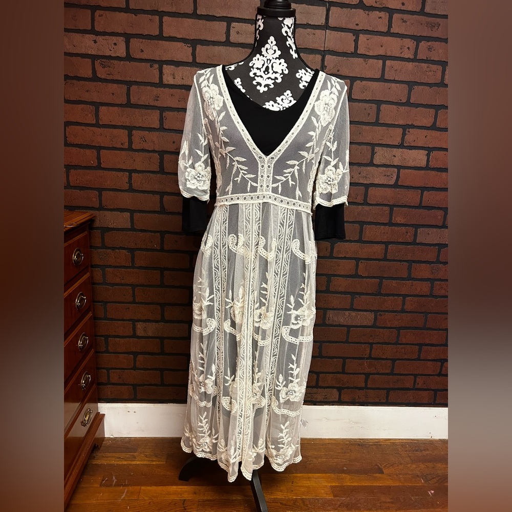 Black dress underneath not included.